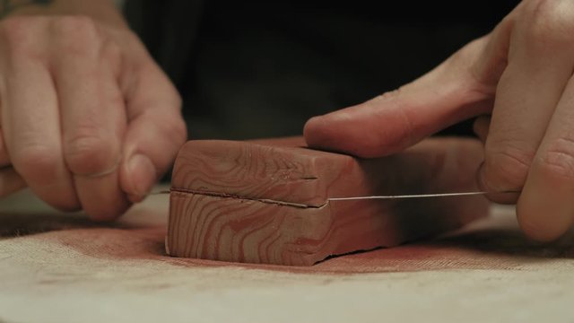 Ceramist work in the workshop.