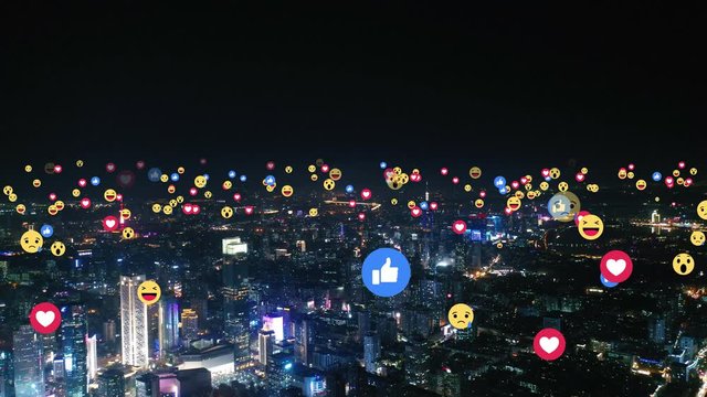Aerial view of city with emojis