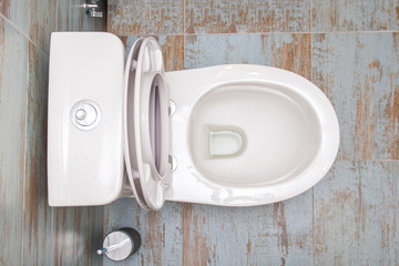 White clean toilet top view. Toilet with an open lid