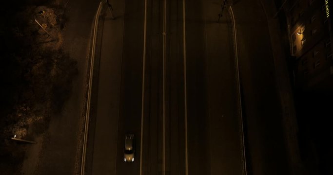 Video from the drone of the road and the bridge over the Vistula River in Warsaw. Climatic night shot of the illuminated bridge with traffic