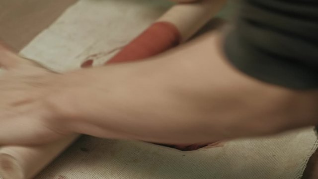 Ceramist work in the workshop.