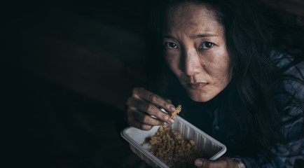 poor people,homeless or beggar begging for help sitting at dirty slum.concept for poverty...