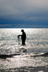Fototapeta na wymiar silhouette of a fisherman
