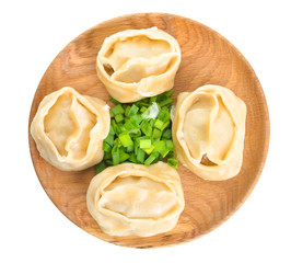 Plate with oriental dumplings on white background