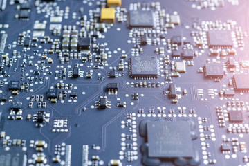 Computer circuit chip board background. Blue processor motherboard technology texture with soft light. Electronic hardware concept.