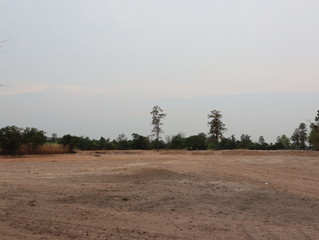 Obraz na płótnie Canvas The empty land prepares the area for rice planting next season.