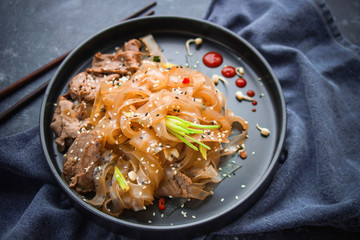 Asian Cuisine, Spicy Asian Beef Noodles on dark background