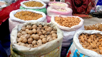 Selling Dry fruits at street market in Old Delhi, India