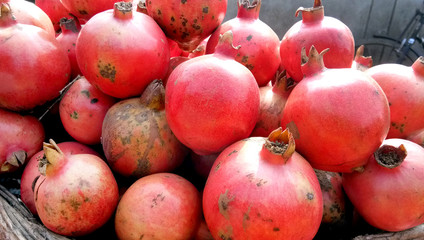 Juicy fresh ripe pomegranates, closeup. Wholesale market