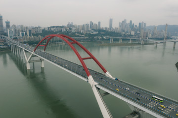 Aerial drone shot of Caiyuanba Changjiang bridge on Yangtze River in Chongqing, southwest China