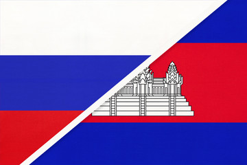 Fototapeta premium Russia vs Cambodia national flag from textile. Relationship and partnership between two countries.