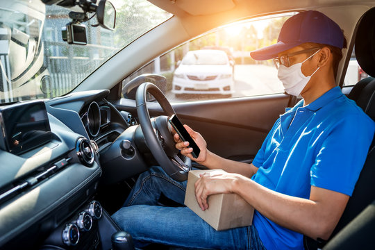 Asian Delivery Man Wearing Mask Protect Covid-19 Virus And Stocktaking Checklist With Amount Of Parcels, Part-time Job Service.