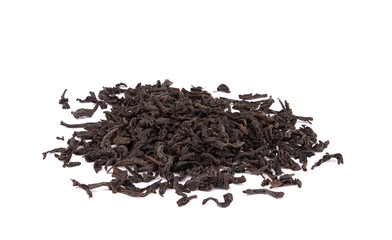 Dry black tea leaves isolated on white background