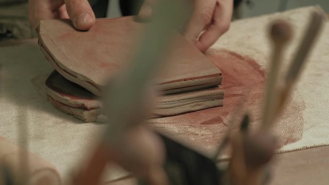 Ceramist work in the workshop.
