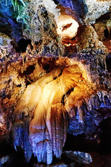 Colorful ancient limestone formations deep underground in the famous Lipa Cave in Montenegro. Natural backgrounds