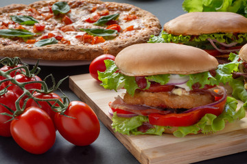 Pizza and hamburgers. Fast food. Still-life.