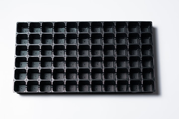 Top view of a black seedling tray