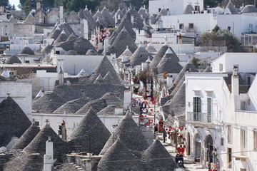 Detail view of white round house with specific architecture and stone roof from unesco world...