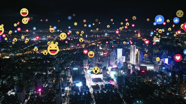 Aerial view of city with emojis