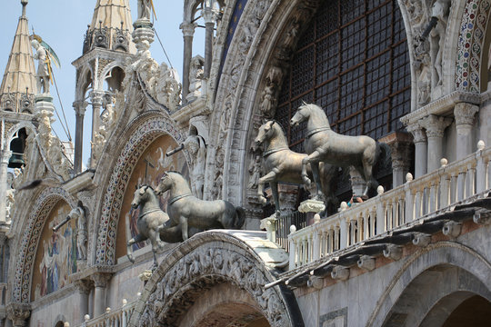 Decoration marvellous horse sculpture and painting in front of Beautiful art christian Cathedral plaza square church in Venice,Italy, house of faithful god, travel destination backgrounds