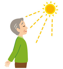 日光浴する高齢者