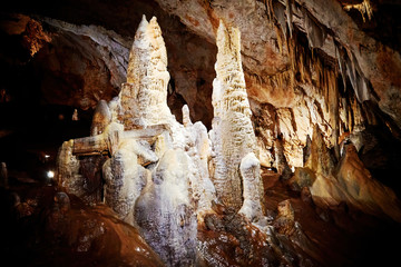 Stalactites and stalagmites deep underground in the famous Lipa Cave in Montenegro. Natural backgrounds - obrazy, fototapety, plakaty