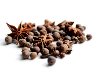 On white background anise, black pepper, allspice. Healthy eating concept. Background to insert text or spice catalog