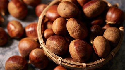 Heap of chestnuts in bamboo bowl 