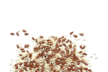 Flax seeds, sunflower seeds, sesame, chia and pumpkin seeds, isolated on white background
