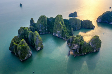 Aerial view floating fishing village and rock island, Halong Bay, Vietnam, Southeast Asia. UNESCO...