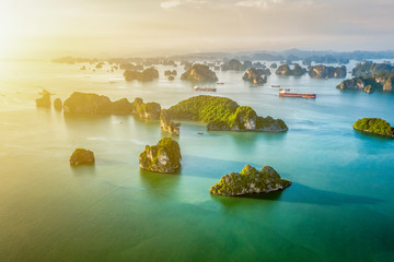 Aerial view floating fishing village and rock island, Halong Bay, Vietnam, Southeast Asia. UNESCO World Heritage Site. Junk boat cruise to Ha Long Bay. Popular landmark, famous destination of Vietnam © Hien Phung