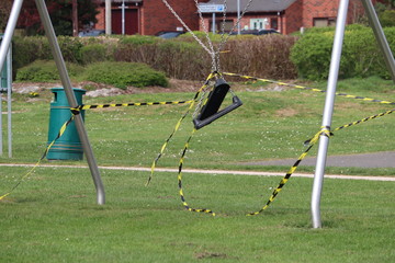 public play area and park land taped off to stop use during coronavirus pandemic