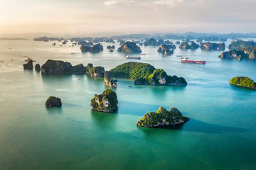 Aerial view floating fishing village and rock island, Halong Bay, Vietnam, Southeast Asia. UNESCO World Heritage Site. Junk boat cruise to Ha Long Bay. Popular landmark, famous destination of Vietnam © Hien Phung