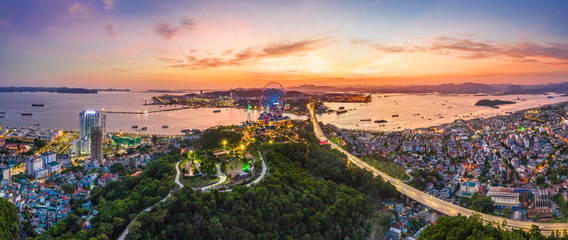 Panorama of Ha Long City, Vietnam, with Sun World Halong park and Bai Chay bridge. Near Halong Bay, UNESCO World Heritage Site. View from Cua Luc bay to Ha Long bay