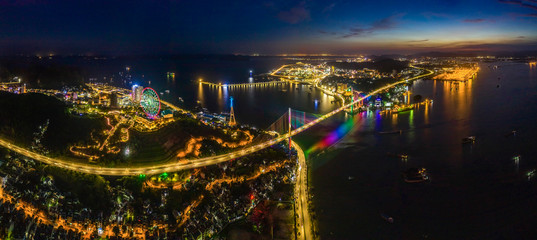 Panorama of Ha Long City, Vietnam, with Bai Chay bridge. Near Halong Bay, UNESCO World Heritage Site. Popular landmark, famous destination of Vietnam. View from center city to Ha Long bay.