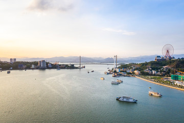 Aerial view of Bai Chay bridge. Near Halong Bay, UNESCO World Heritage Site. Popular landmark, famous destination of Vietnam. View from Ha Long bay to Cua Luc bay