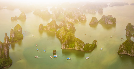 Aerial view Ba Hang floating fishing village, rock island, Halong Bay, Vietnam, Southeast Asia. UNESCO World Heritage Site. Junk boat cruise to Ha Long Bay. Famous destination of Vietnam © Hien Phung