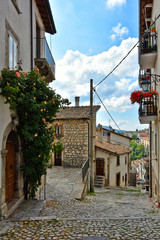 A narrow street between the houses of a tourist town in the Abruzzo region of Italy