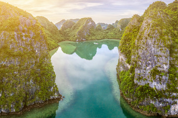 Aerial view of Cua Van floating fishing village and rock island, Halong Bay, Vietnam, Southeast Asia. UNESCO World Heritage Site. Junk boat cruise to Ha Long Bay. Famous destination of Vietnam © Hien Phung