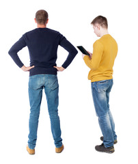 Back view of two man in sweater with mobile phone.