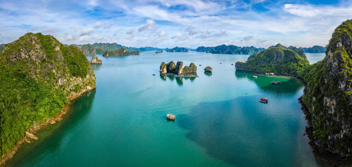 Aerial view of Cua Van floating fishing village and rock island, Halong Bay, Vietnam, Southeast Asia. UNESCO World Heritage Site. Junk boat cruise to Ha Long Bay. Famous destination of Vietnam © Hien Phung