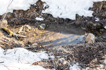 beautiful winter landscape with lots of snow and a creek