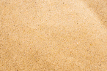 Brown eco recycled kraft paper sheet texture cardboard background
