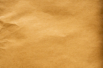 Brown crumpled paper recycled kraft sheet texture background