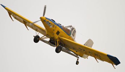 an old yellow airplane 