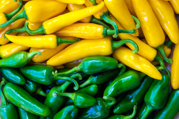 Yellow and green hot peppers closeup. Food photography
