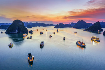 Aerial view floating fishing village and rock island, Halong Bay, Vietnam, Southeast Asia. UNESCO...