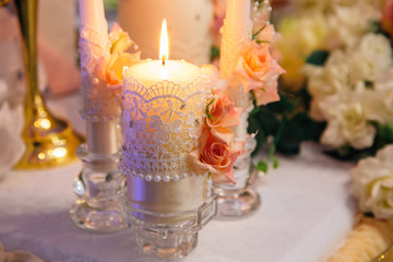 candles decorated with lace and flowers