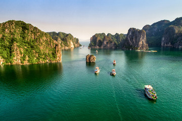 Aerial view floating fishing village and rock island, Halong Bay, Vietnam, Southeast Asia. UNESCO World Heritage Site. Junk boat cruise to Ha Long Bay. Popular landmark, famous destination of Vietnam © Hien Phung