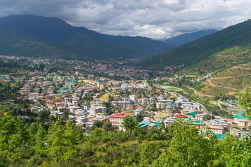 Fototapeta na wymiar Top view Thimpu city, the capital of Bhutan surrounded by mountains in summer season